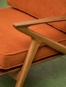 Ziggy Walnut Lounge Chair in Orange Corduroy