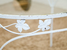 Vintage Wrought Iron Patio Dining Table with Leaf Motif Aqua Cushions and Glass Top