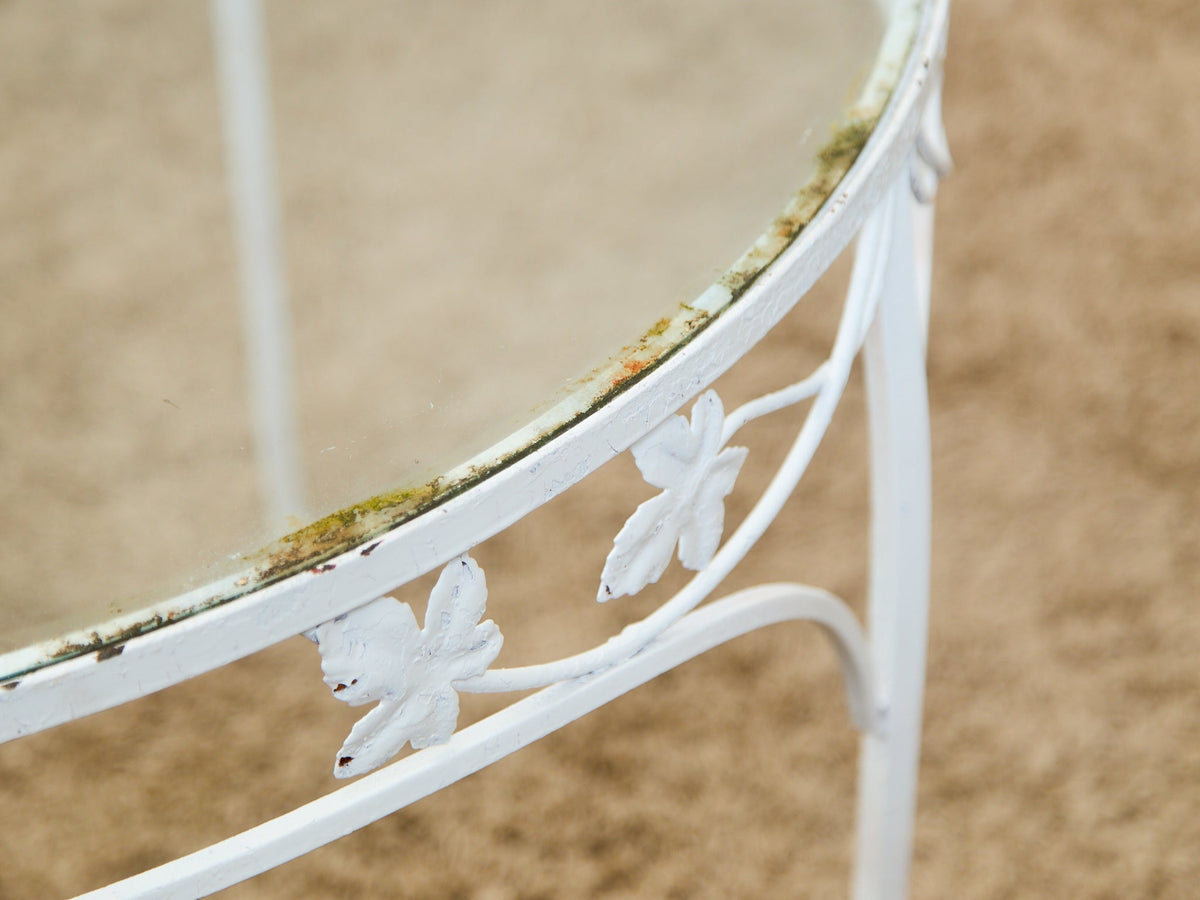 Vintage Wrought Iron Patio Dining Table with Leaf Motif Aqua Cushions and Glass Top
