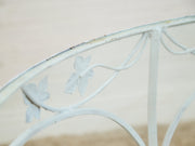 Vintage Wrought Iron Patio Dining Table with Leaf Motif Aqua Cushions and Glass Top