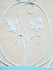 Vintage Wrought Iron Patio Dining Table with Leaf Motif Aqua Cushions and Glass Top