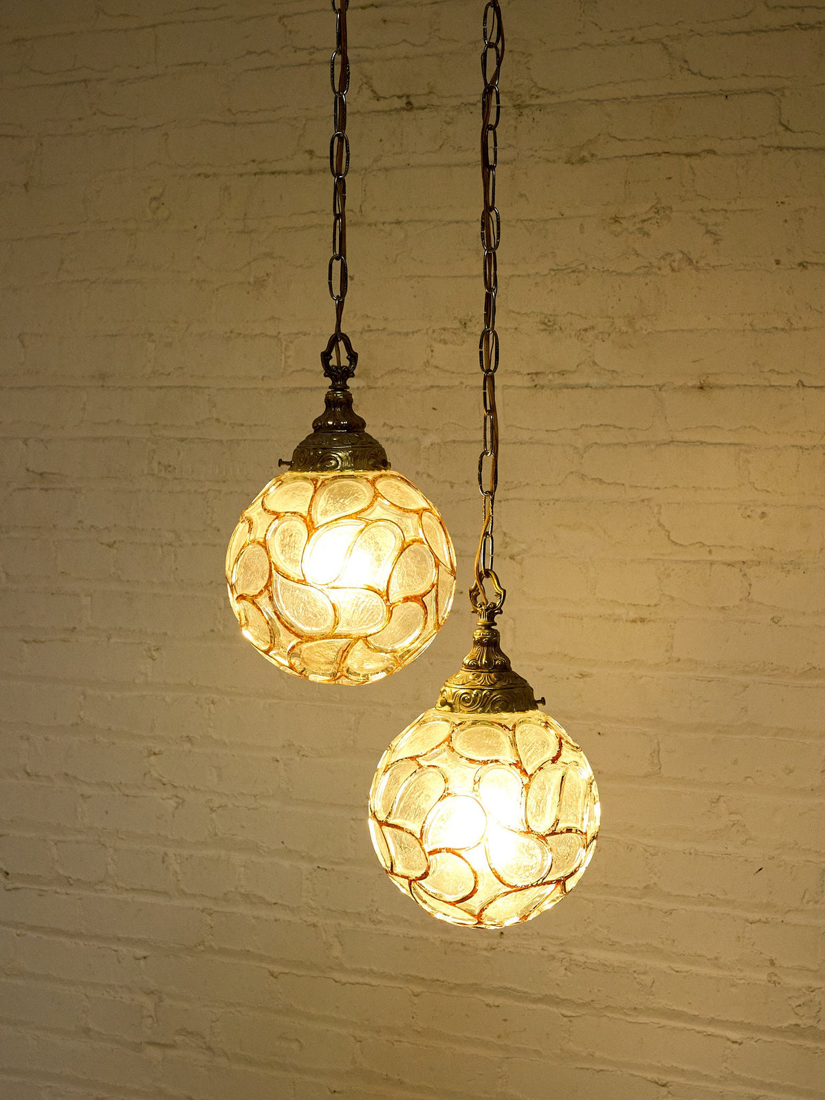 Pair of Vintage Faceted Glass Globe Pendant Lights with Ornate Brass Caps