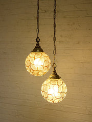 Pair of Vintage Faceted Glass Globe Pendant Lights with Ornate Brass Caps