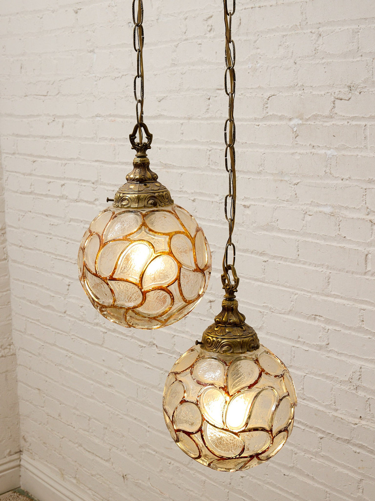 Pair of Vintage Faceted Glass Globe Pendant Lights with Ornate Brass Caps