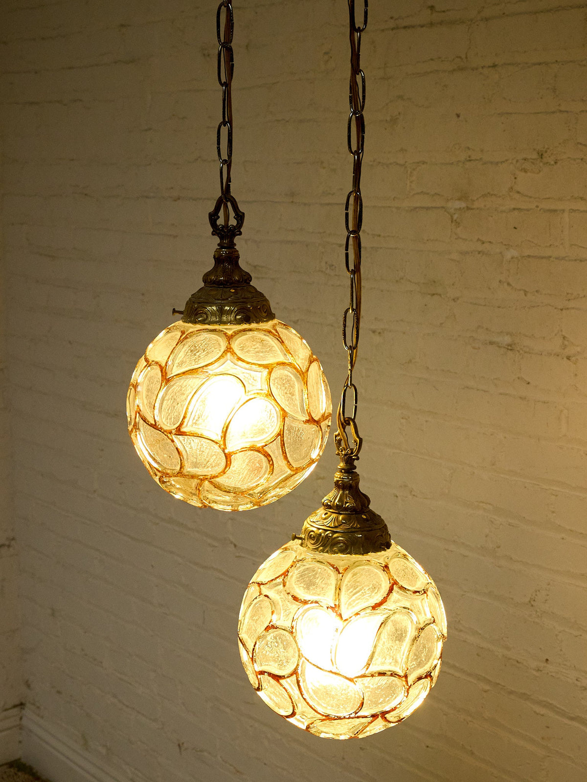 Pair of Vintage Faceted Glass Globe Pendant Lights with Ornate Brass Caps