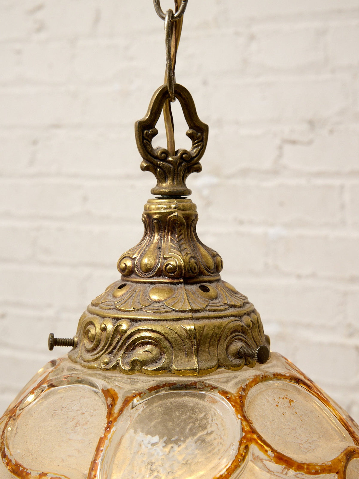 Pair of Vintage Faceted Glass Globe Pendant Lights with Ornate Brass Caps